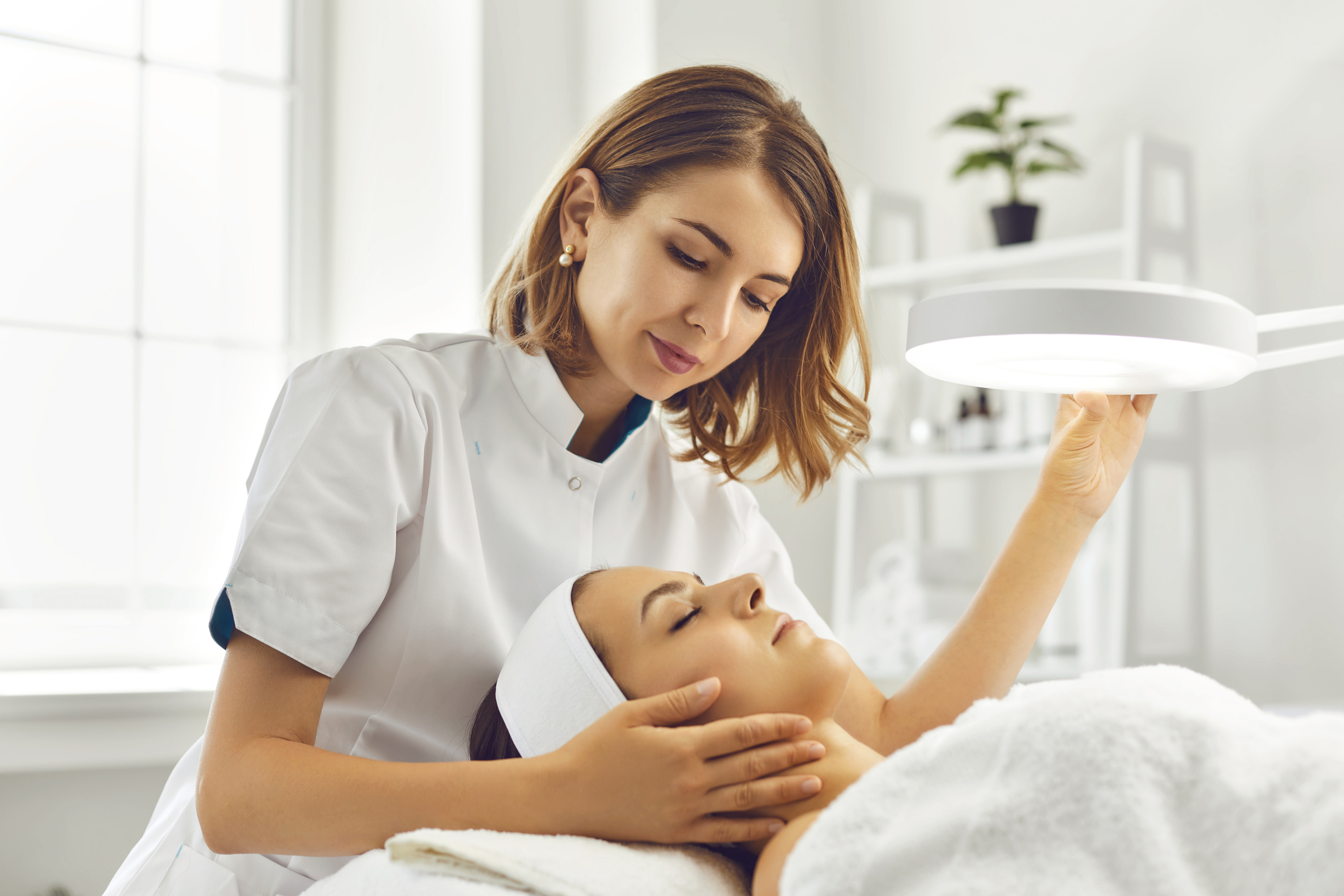 a dermatologist treating a patient