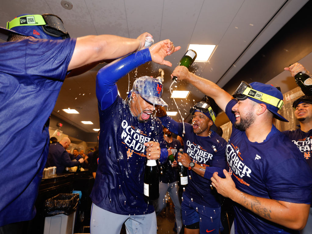 Mets players celebrating in their locker room