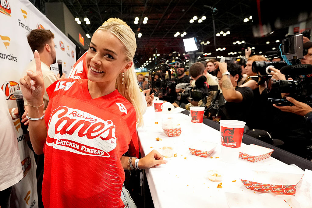 Influencer Livvy Dunne at a Raisin' Canes booth