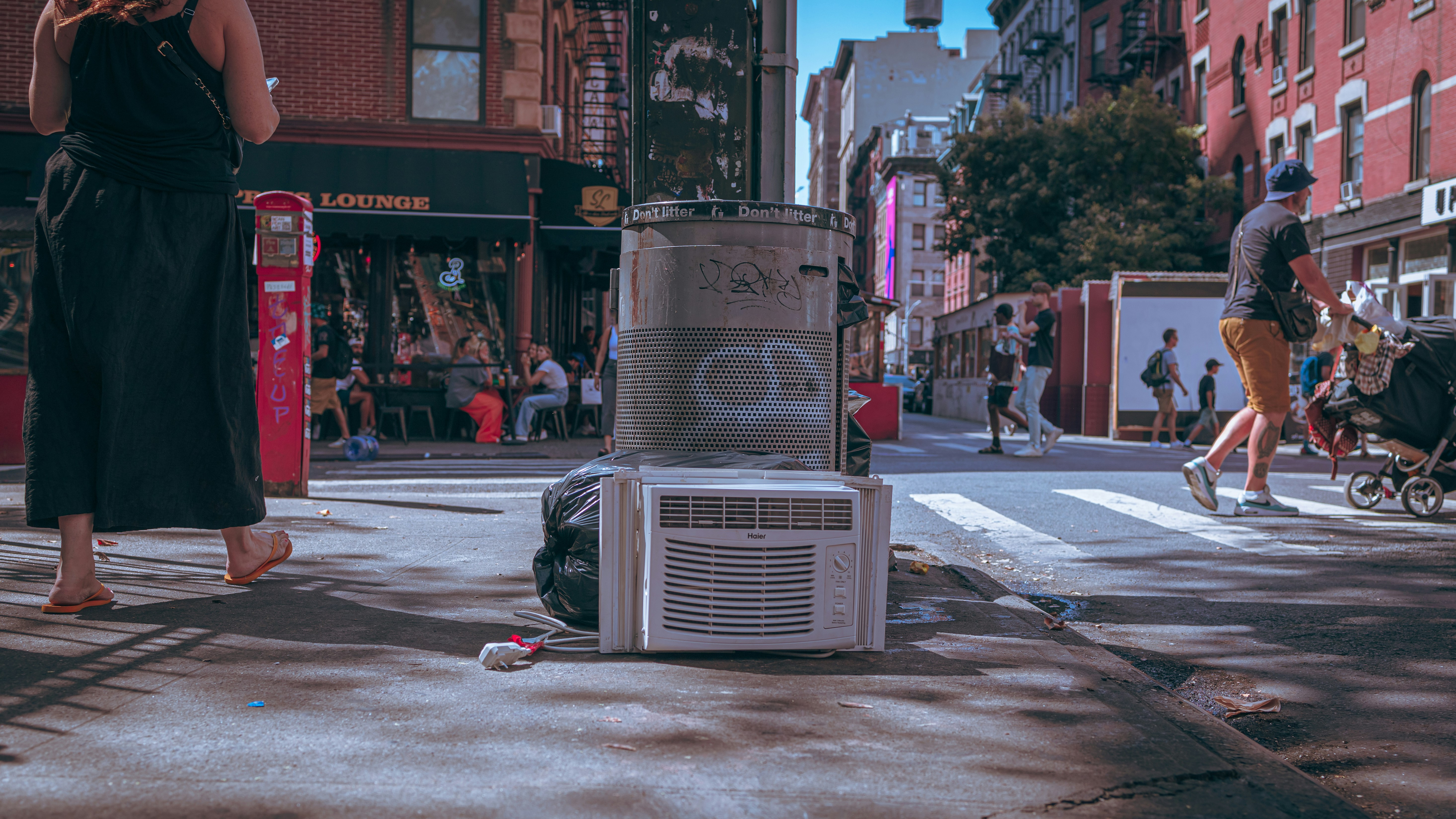 An NYC sidewalk garbage can.