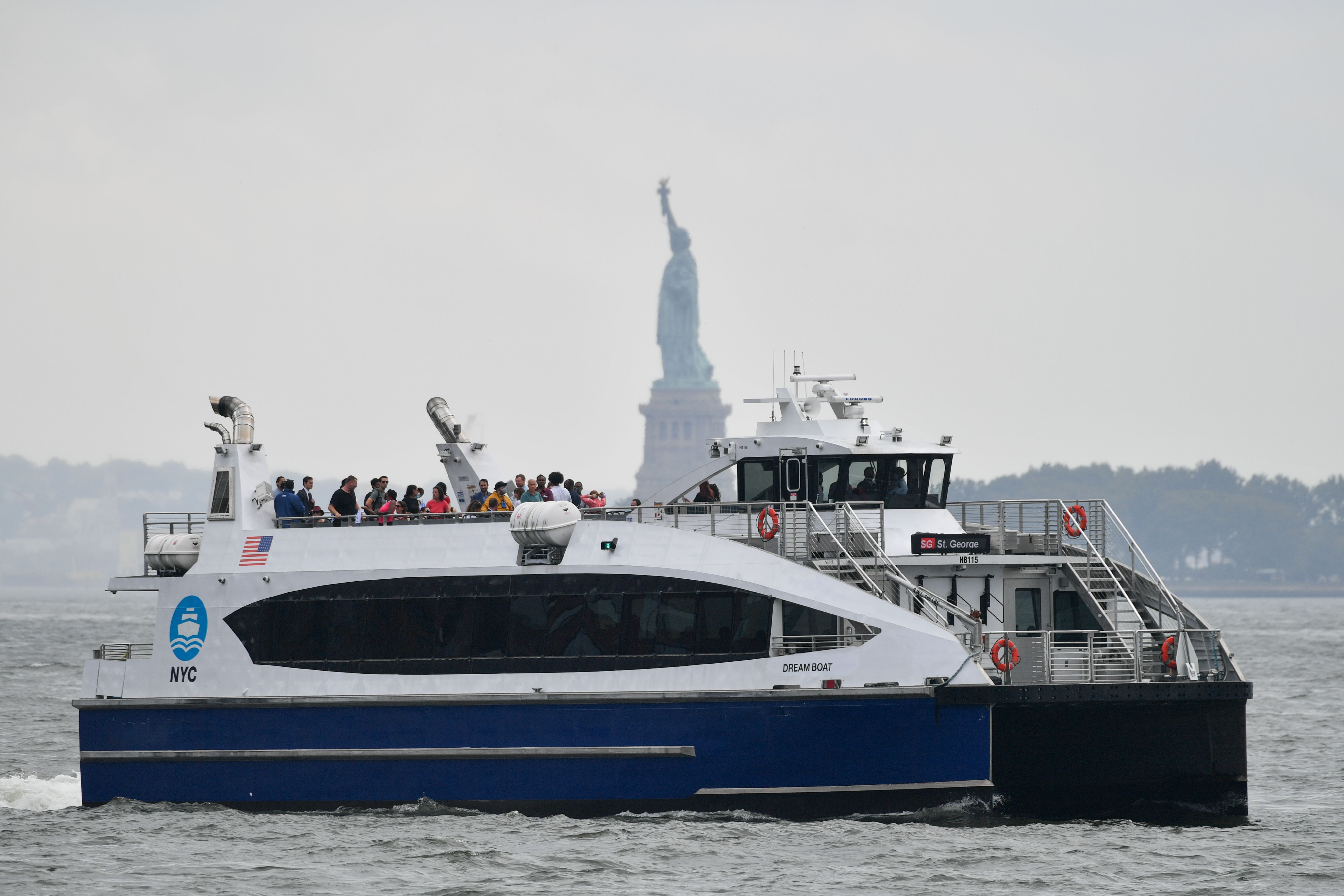 A NYC Ferry rides along the Hudson River during it's inaugural St. George ferry route from Staten Island to the West Side of Manhattan. The New York City Council passed a bill providing discounted NYC Ferry prices to high school students.