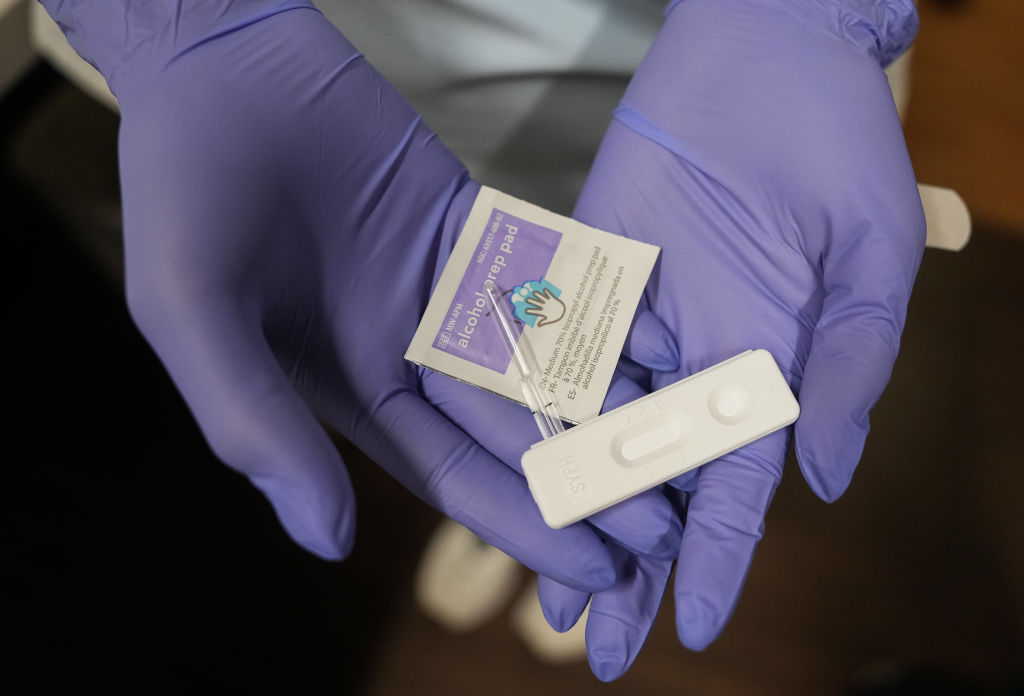 a nurse holds a congenital syphilis test