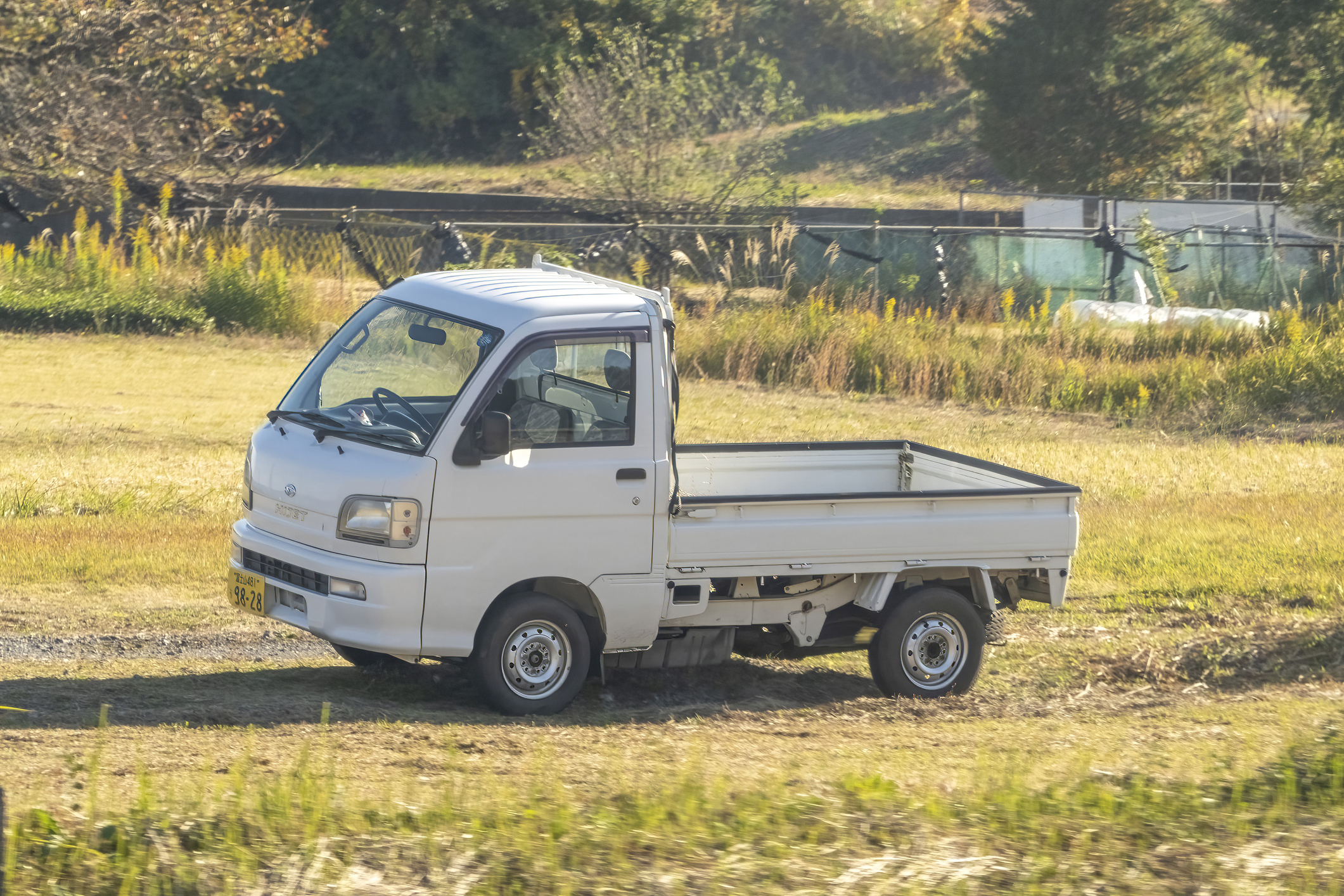 a kei truck in a field